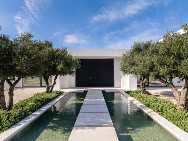 Arrival at Ble Kyma is via stepping stones over a water feature.